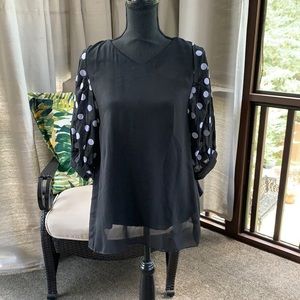 Black with white polka dots.